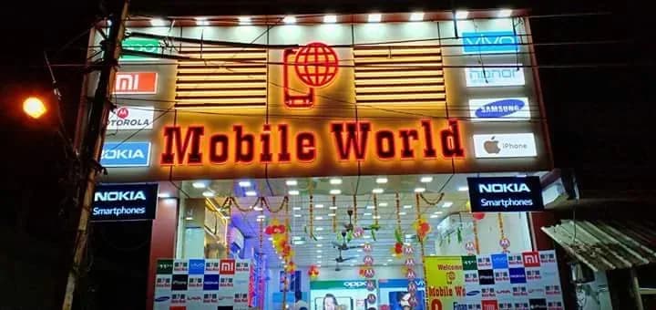 Mobile World storefront on Gurudwara Road, Jawahar Colony, lit up at night